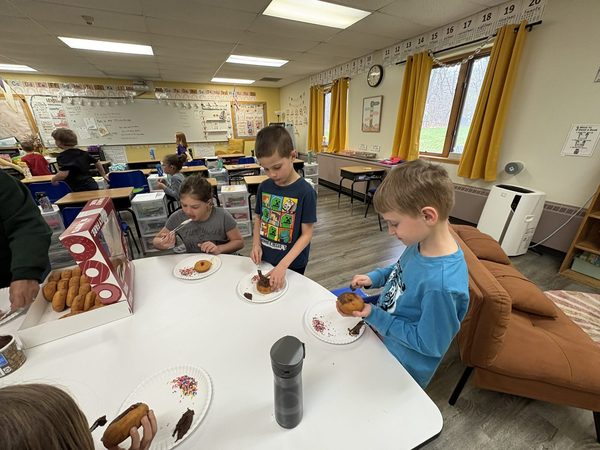 Children enjoying a donut activity as part of an I Love You Like A Donut family experience