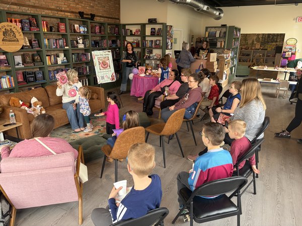 Children and families gathered for a bookstore storytime