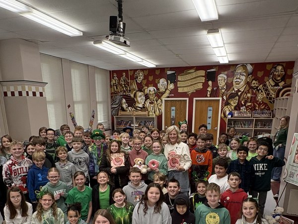 Theresa with a large group of students after a school author visit
